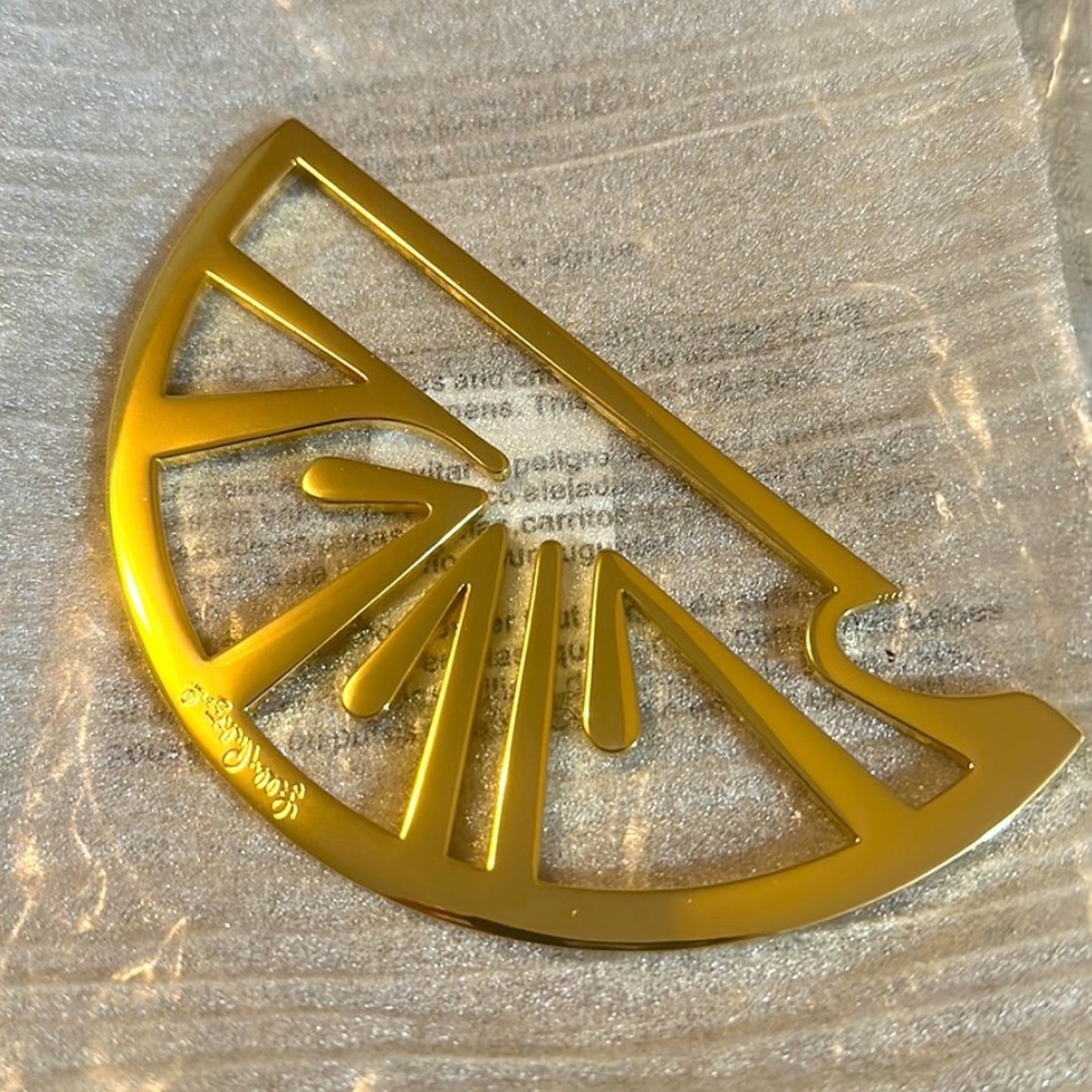 Lilly Pulitzer gold bottle opener.